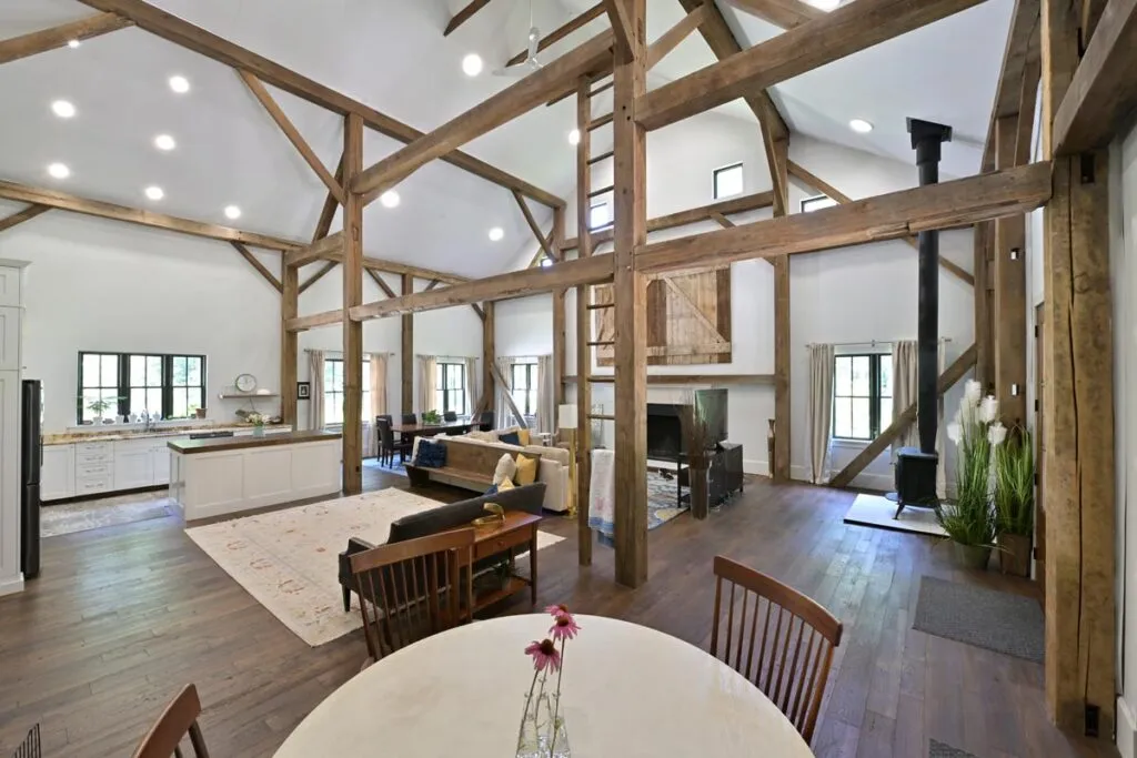 Vaulted great room with exposed sawn oak beams in the Delaware, Ohio timber frame barn home