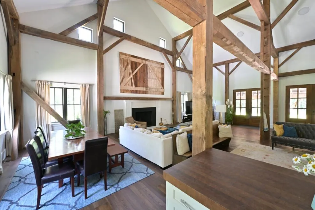 Kitchen and dining area beneath the restored German bank barn frame in Delaware, Ohio