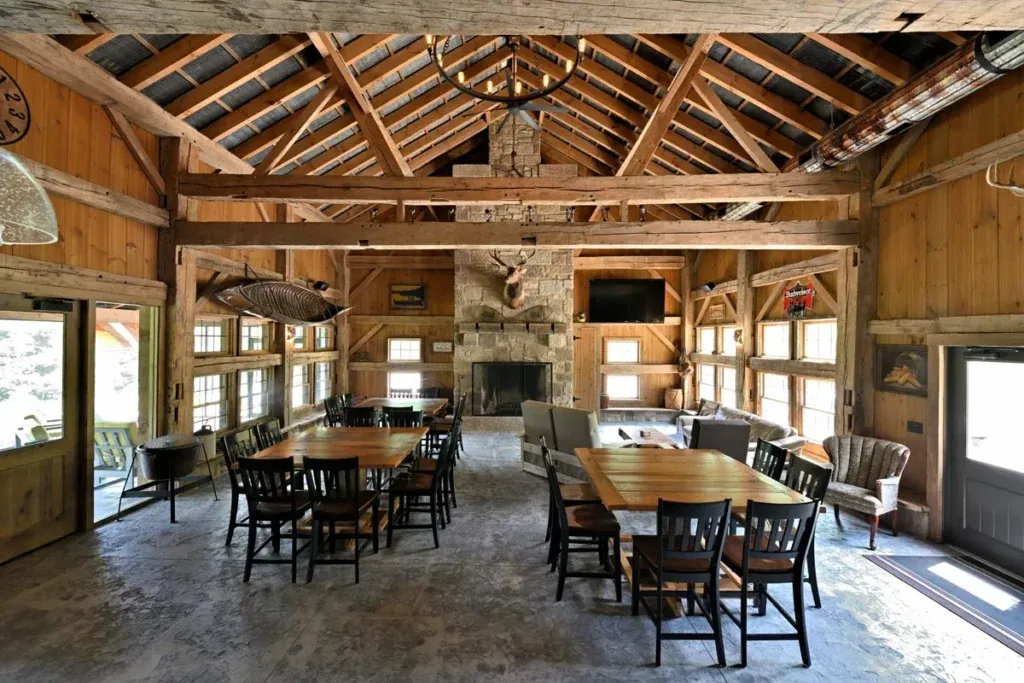 Rumford fireplace and open timber frame interior of the Dover Party Barn in Dover, Ohio