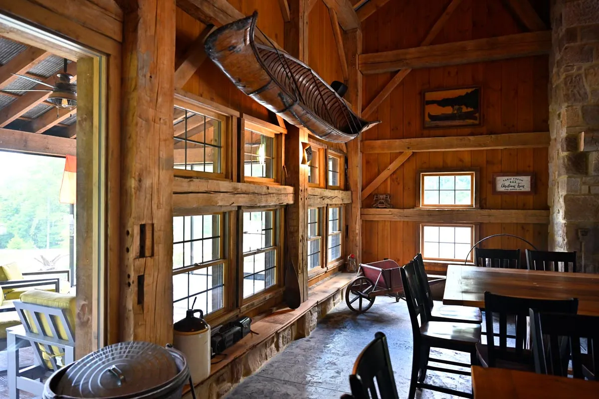 Stone chimney and timber porch detail at the Dover Party Barn in Dover, Ohio