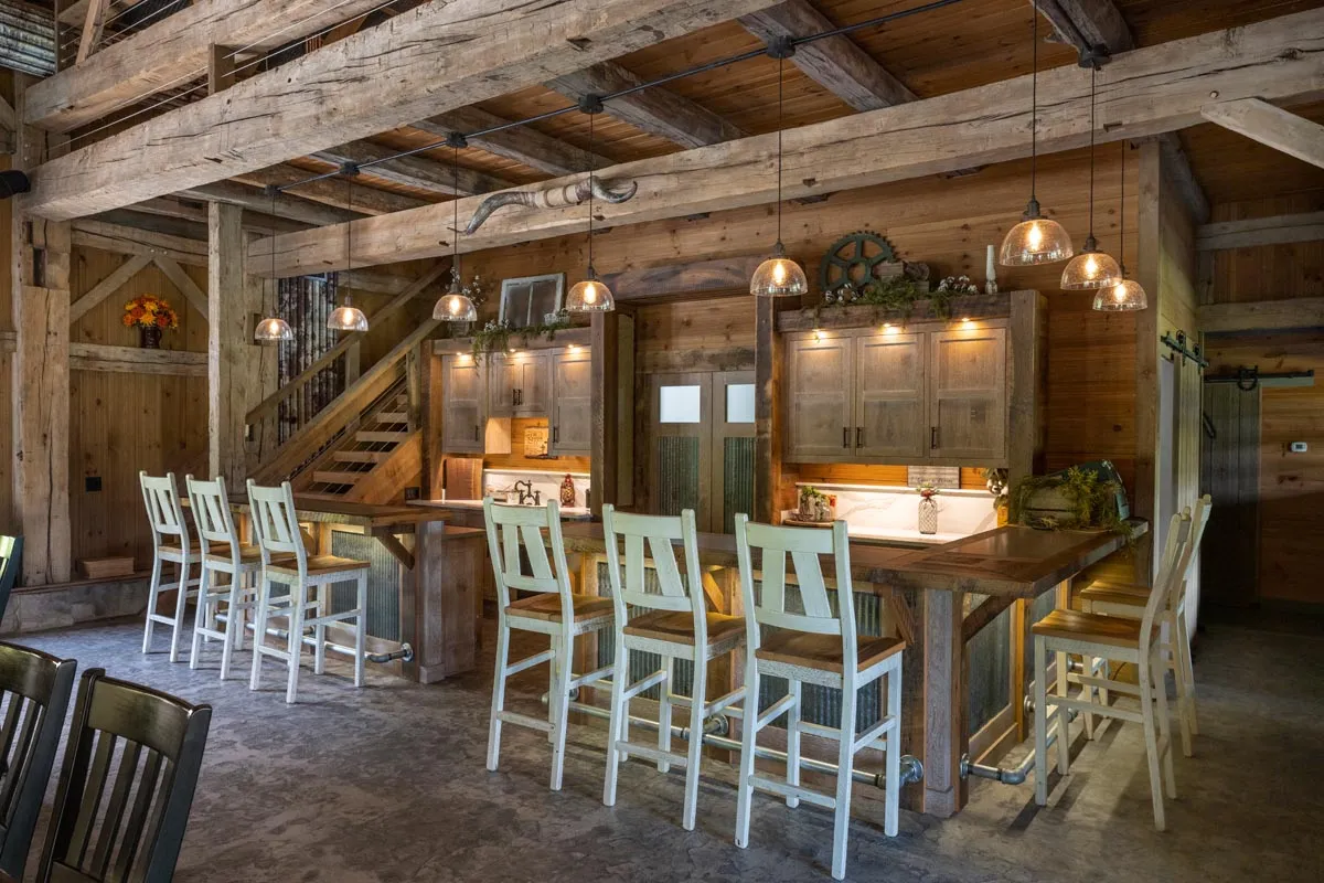 Rumford fireplace built into the historic white oak frame of the Dover Party Barn