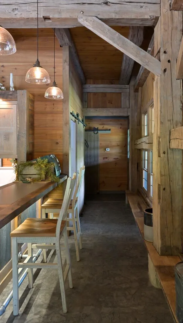 Loft seating area overlooking the timber frame interior of the Dover Party Barn in Ohio