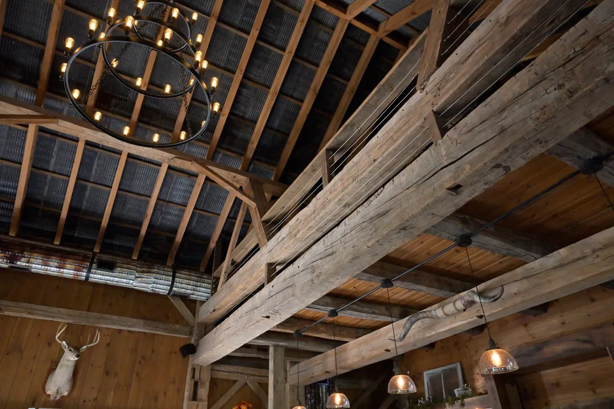 Vaulted white oak timber frame great room inside the Dover Party Barn in Dover, Ohio