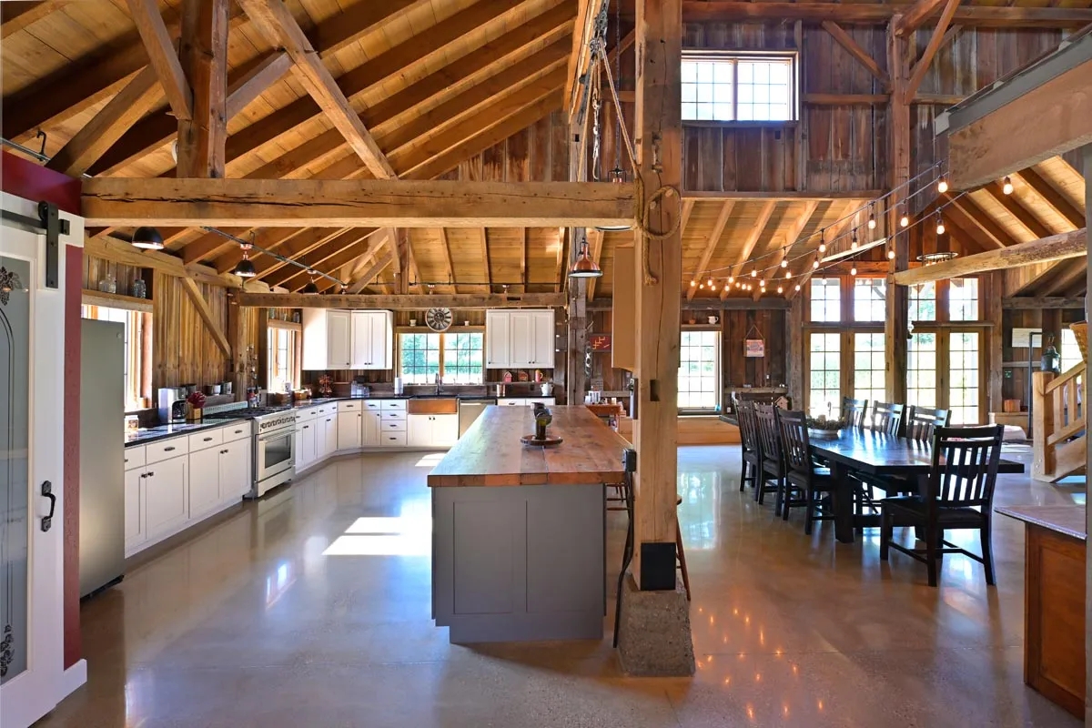 White-cabinet barn kitchen with pendant lighting in the Newcomerstown, Ohio barn home