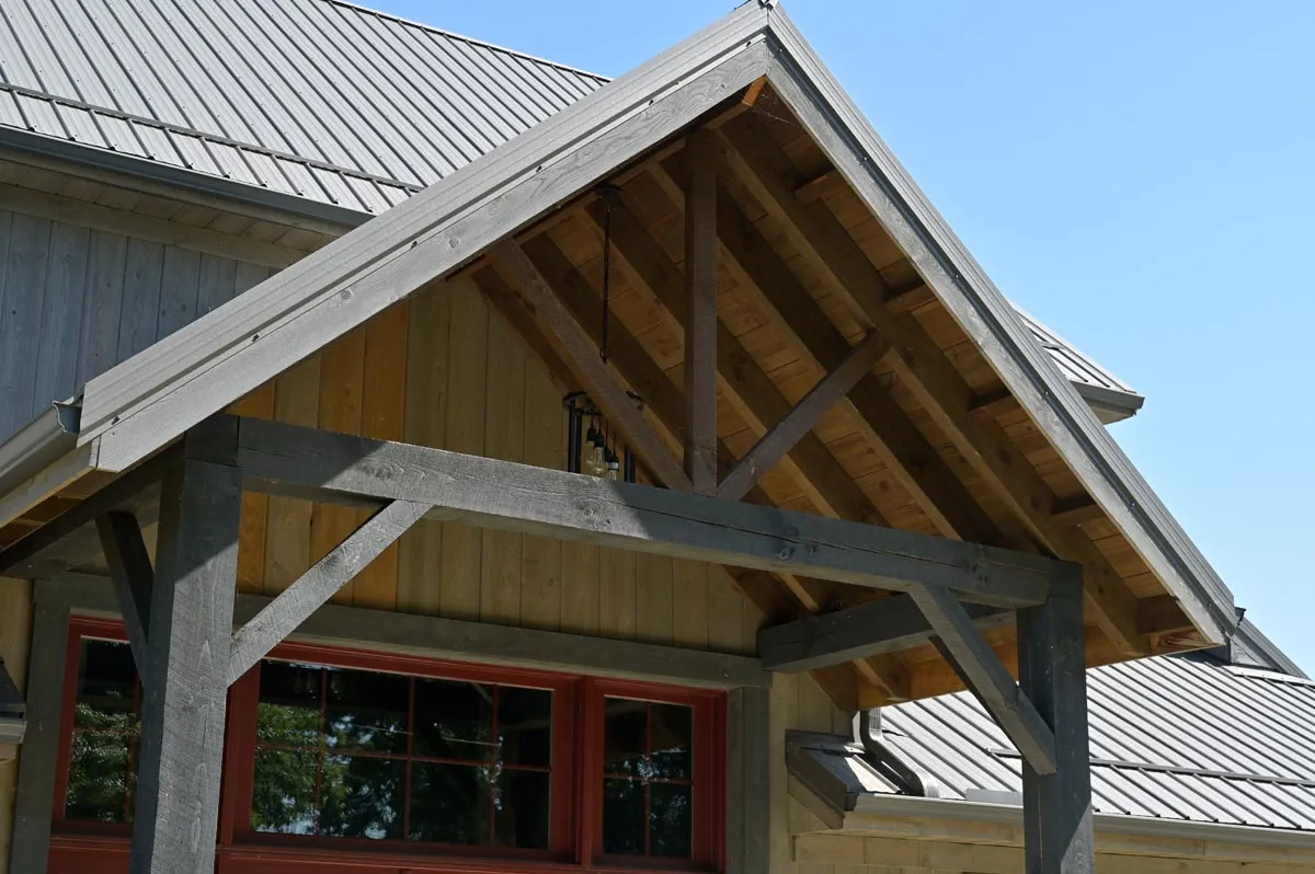 Converted barn home exterior with board siding and metal roof in Newcomerstown, Ohio