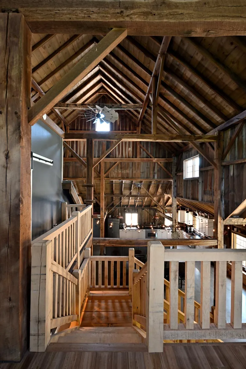 Timber frame interior with exposed vintage beams during an Ohio barn home conversion
