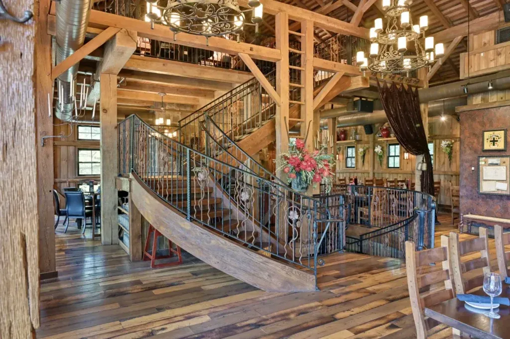 Heavy-timber king truss entrance built by Sugarcreek Builders at The Twisted Olive, Gervasi Vineyard