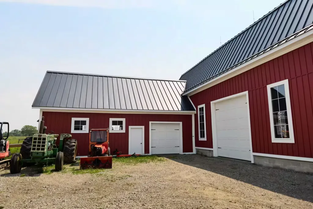 Wide overhead doors and red board-and-batten siding on the restored Gervy Barn near Oberlin, Ohio