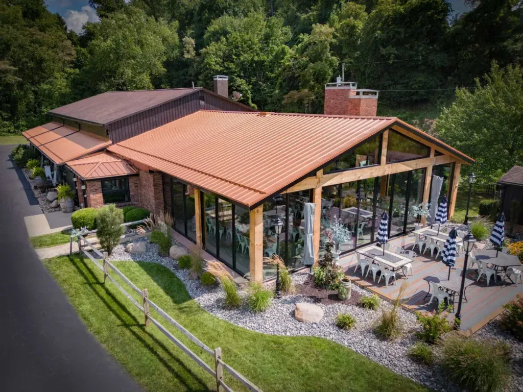 Clear-span heavy-timber pavilion addition at Hidden Acres Lodge & Winery wedding venue in Mingo Junction, Ohio