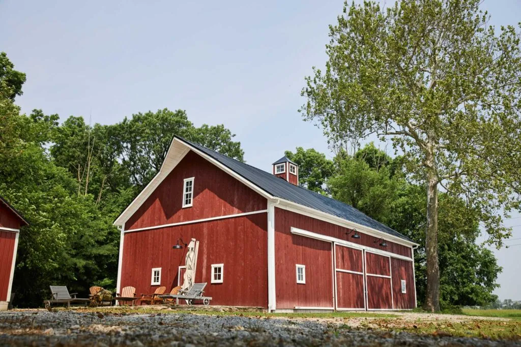 Restored Miller Barn in Oak Harbor, Ohio with fresh red hemlock siding, white trim and new metal roof